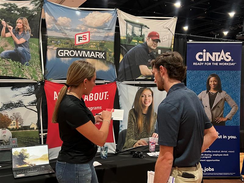 student interacting with Growmark representative