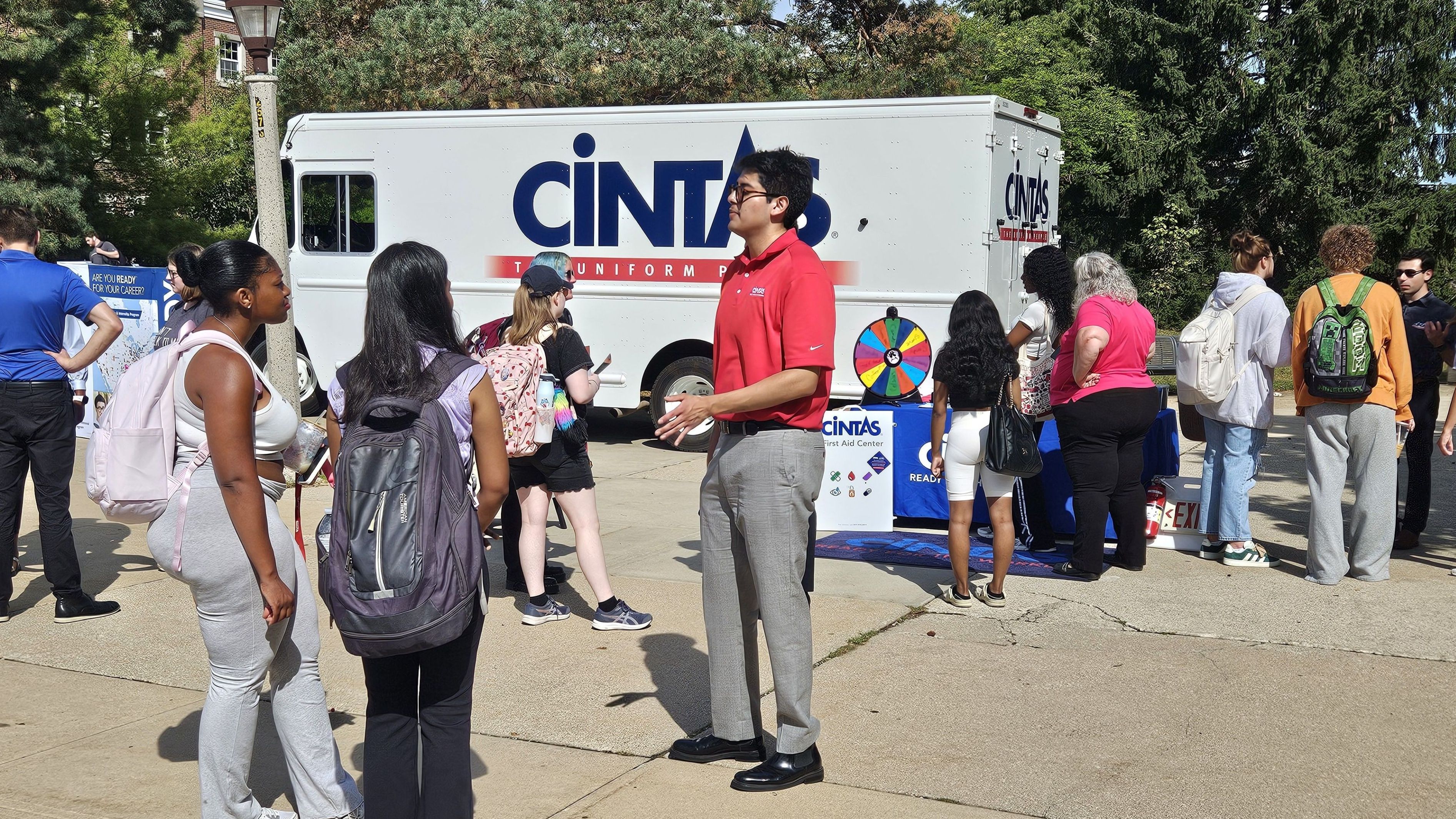 Cintas representatives tabling outside and speaking to students