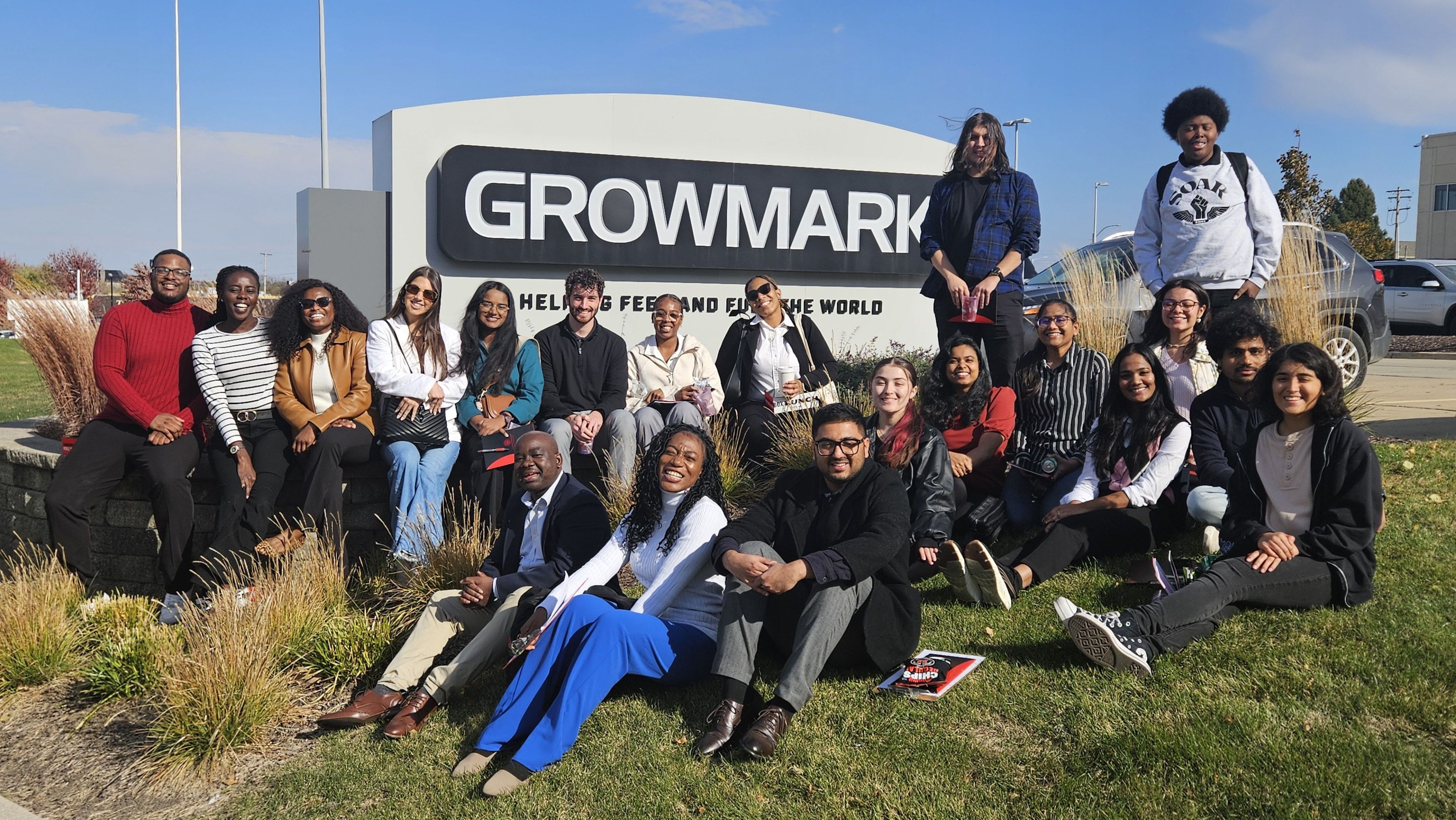 Students in front of the Growmark campus sign