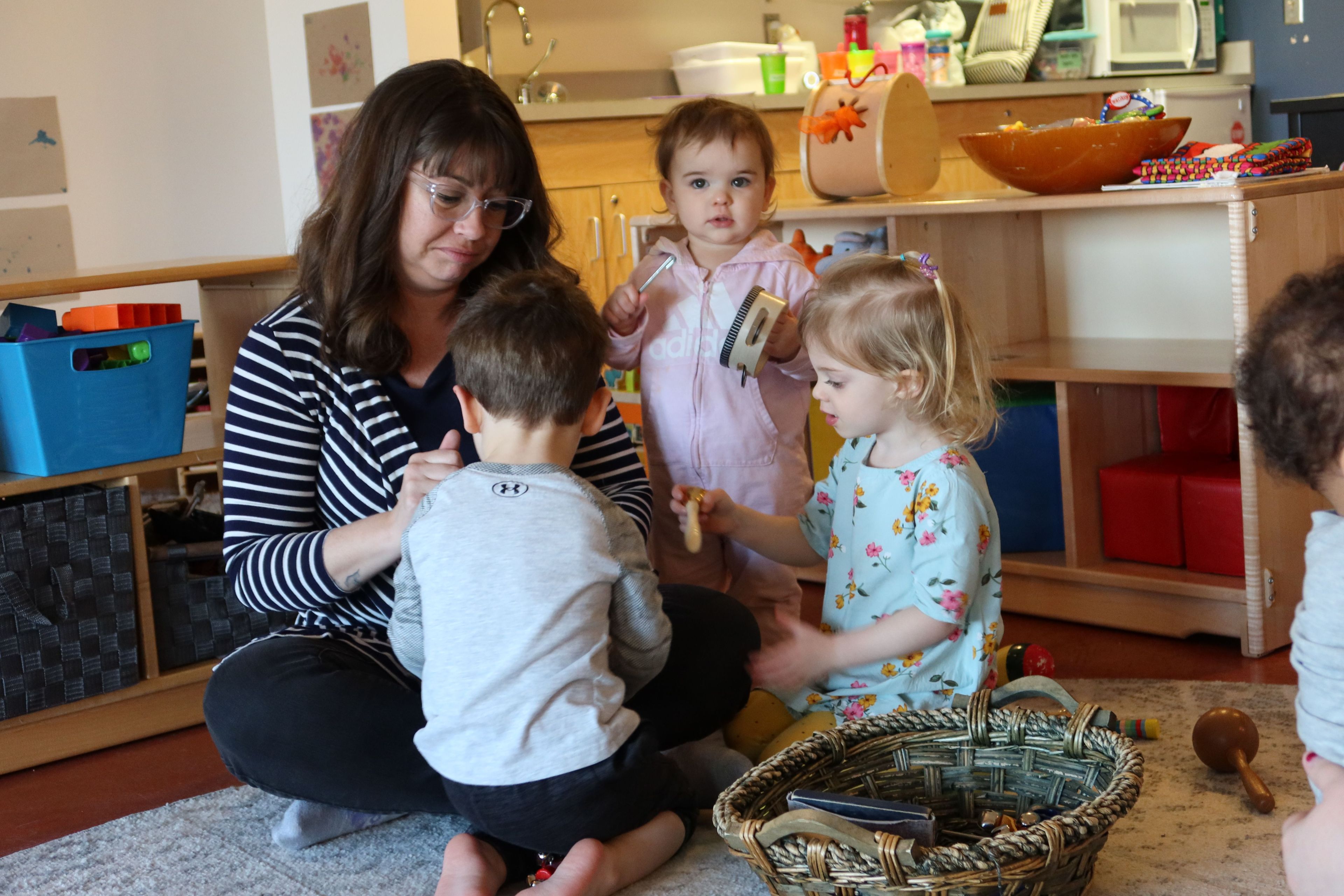 Ashley teaching three students.